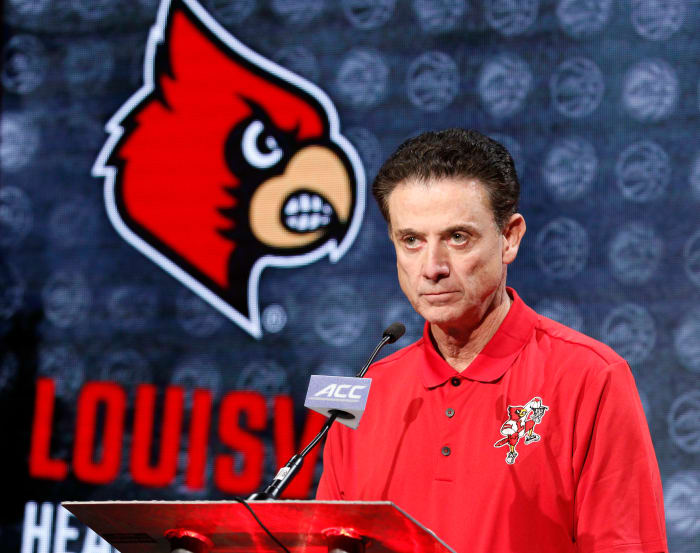 Rick Pitino listens to a question at a press conference.